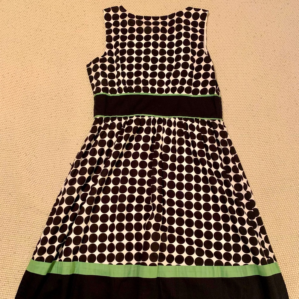 Black and white polkadot sleeveless swing dress